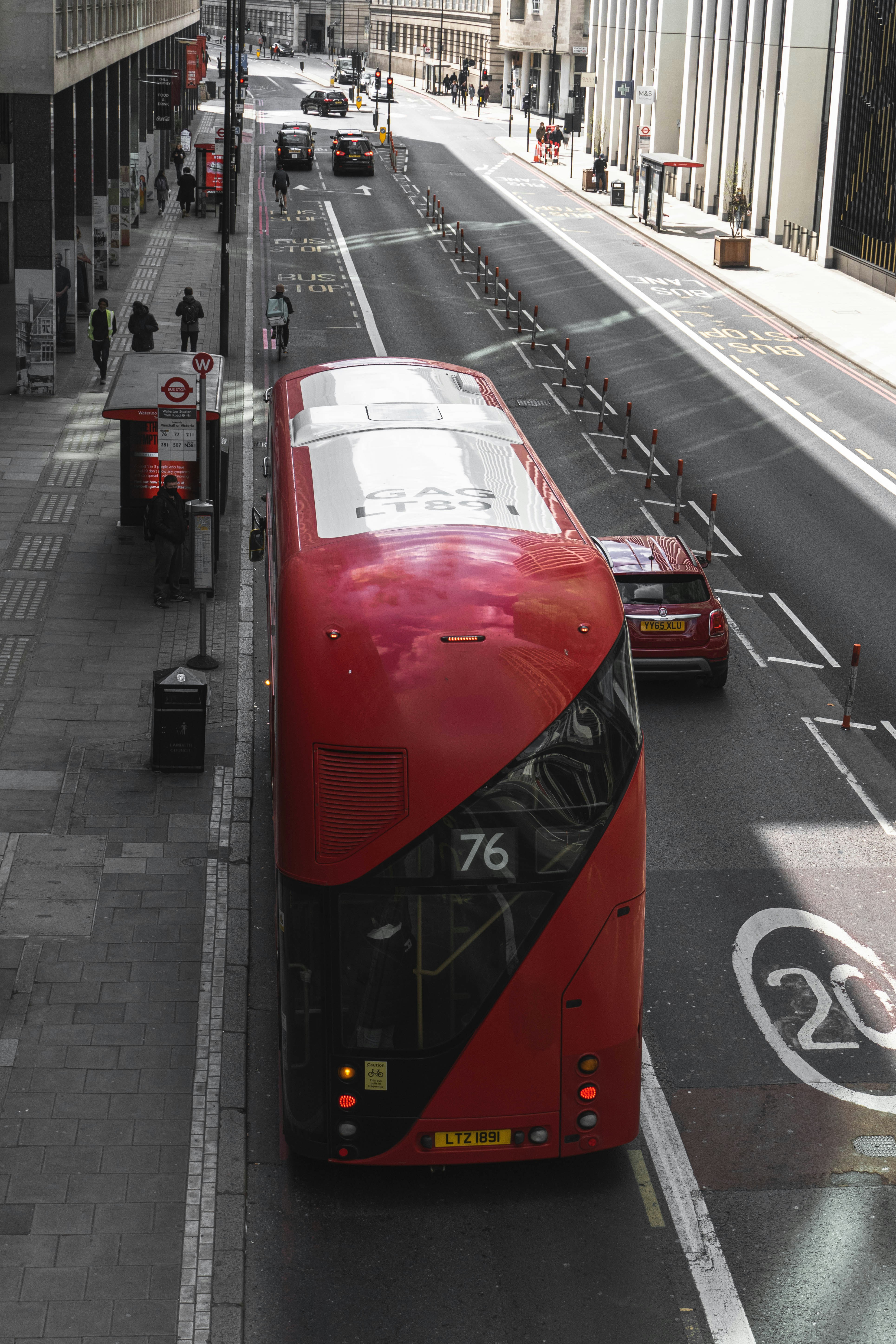Red and black train on the street during daytime photo – Free London ...
