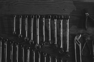 silver skeleton keys on black surface