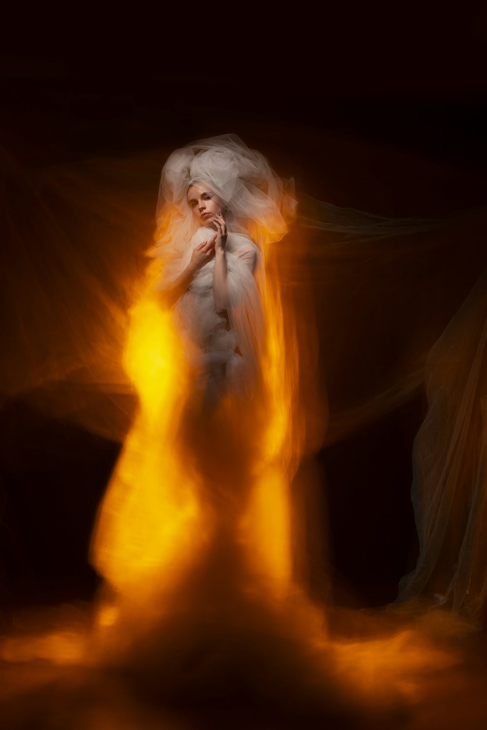 woman in white dress with orange smoke
