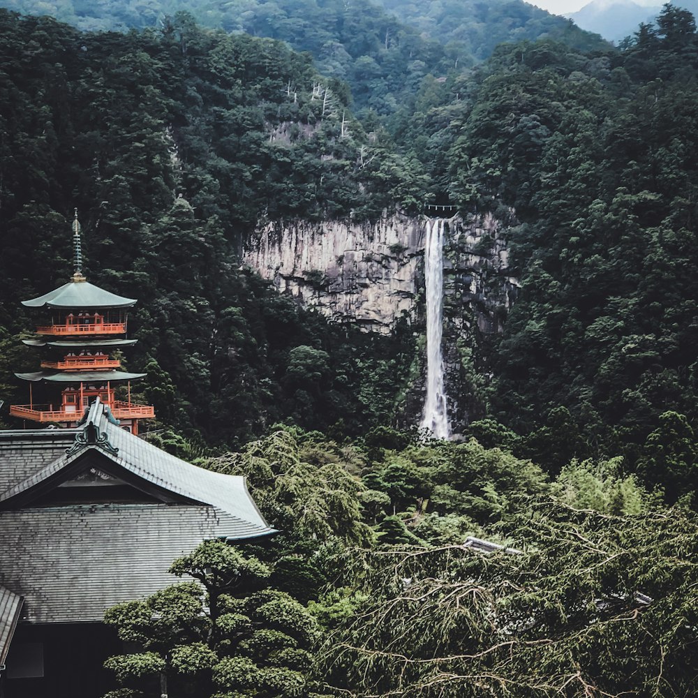 a tall building sitting in the middle of a forest