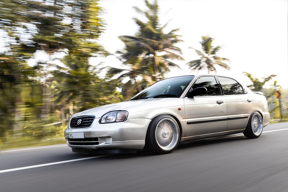 silver mercedes benz sedan on road during daytime