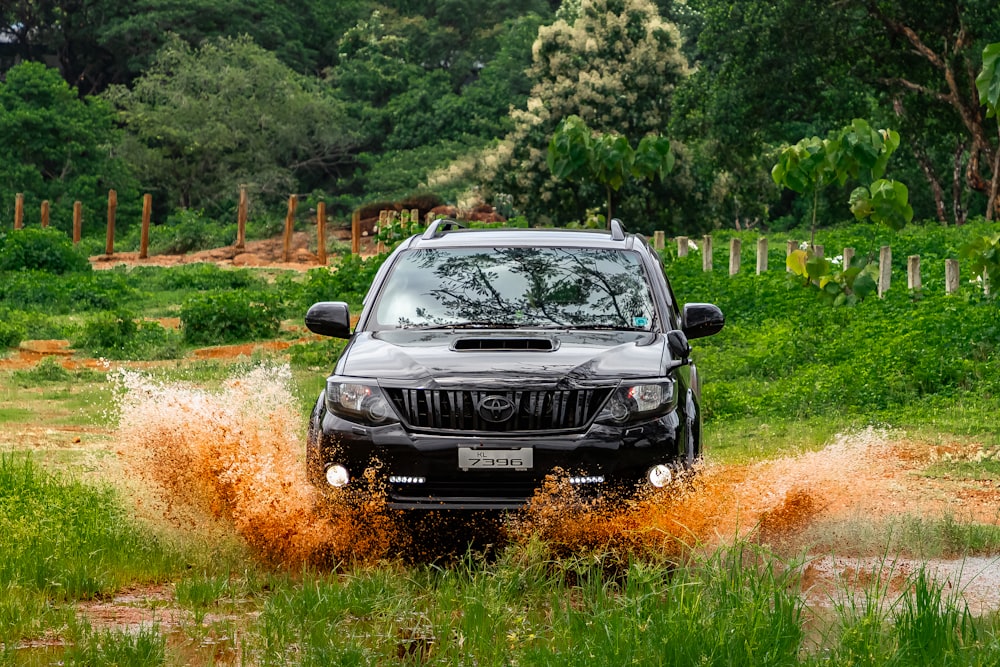 black jeep suv on brown grass field during daytime