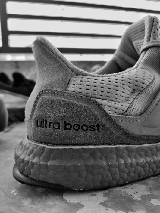 Close-up of sleek urban sneakers on a textured concrete background.