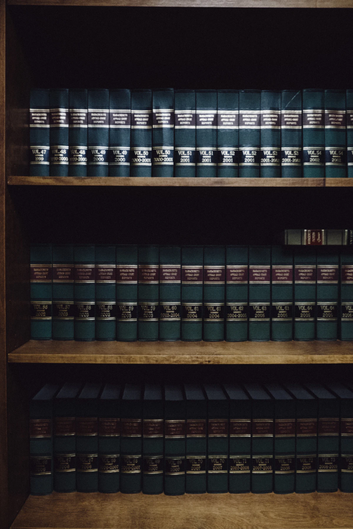 A quiet reading room lined with legal volumes and a study desk