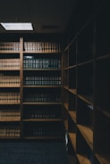 brown wooden shelf with books