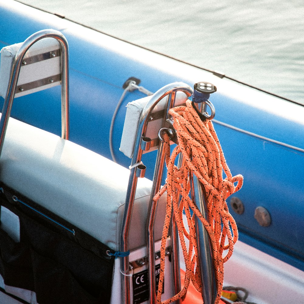 blue and red rope on blue and white boat