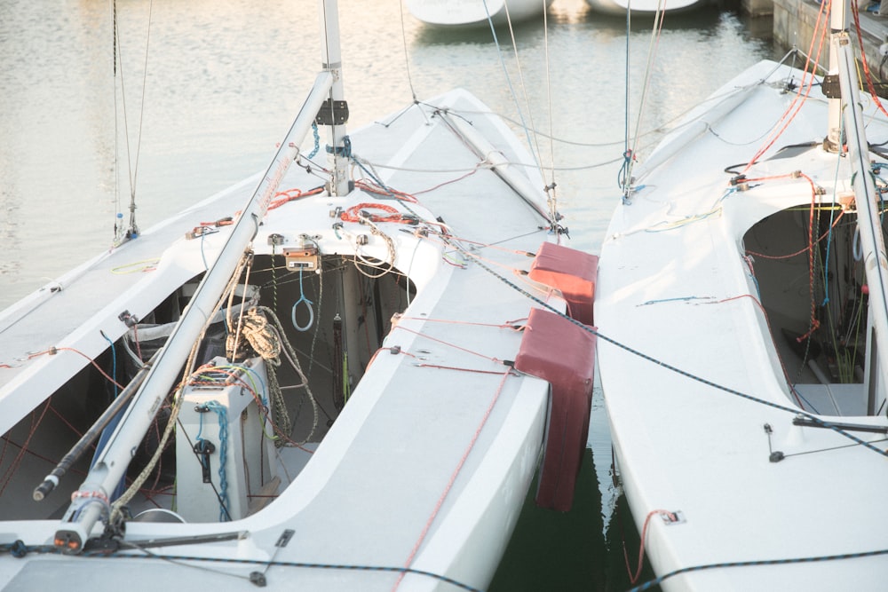 white and red boat on sea during daytime