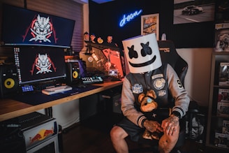 man in black and white mask sitting on black chair