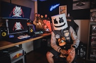 man in black and white mask sitting on black chair
