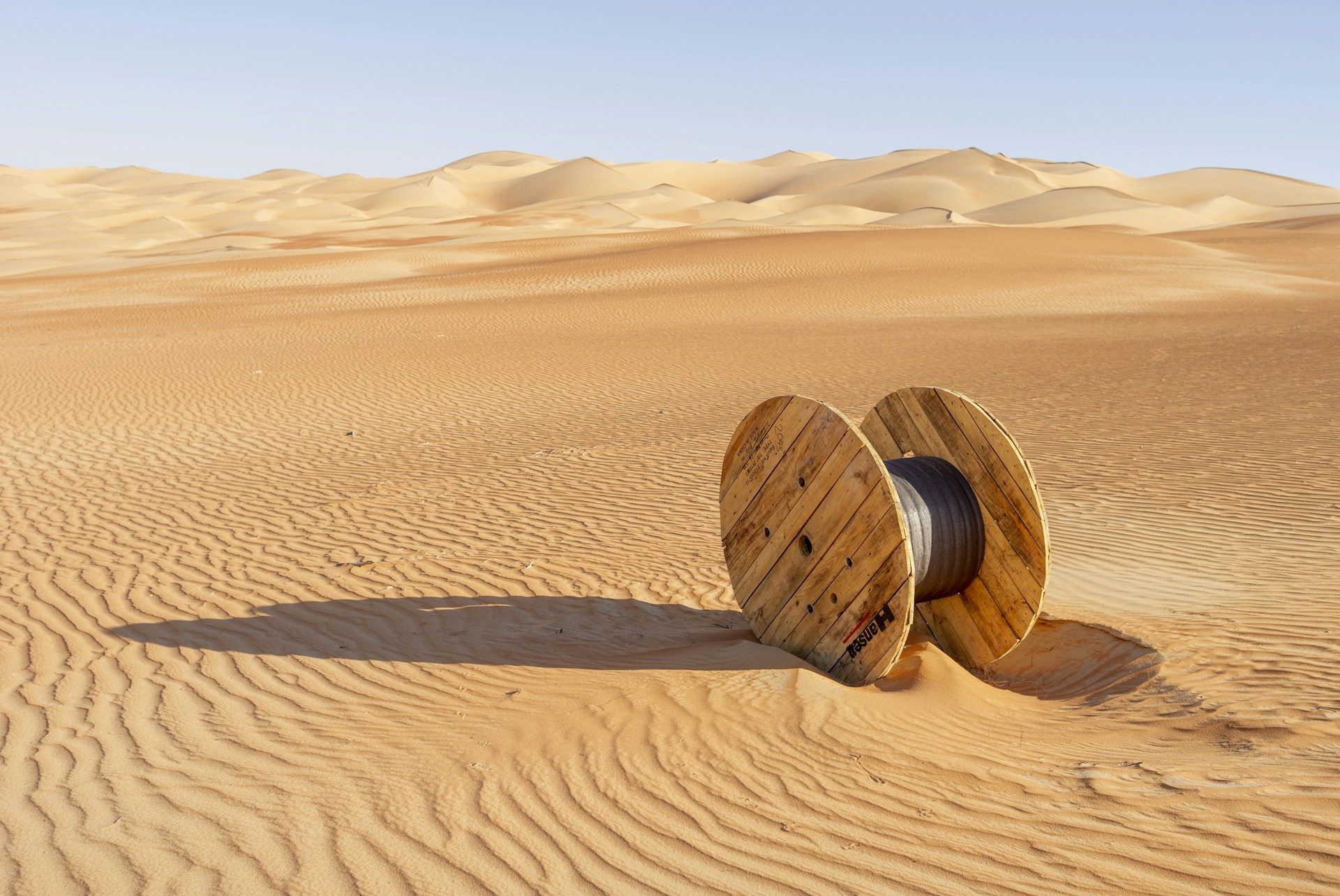 brown wooden round frame on brown sand