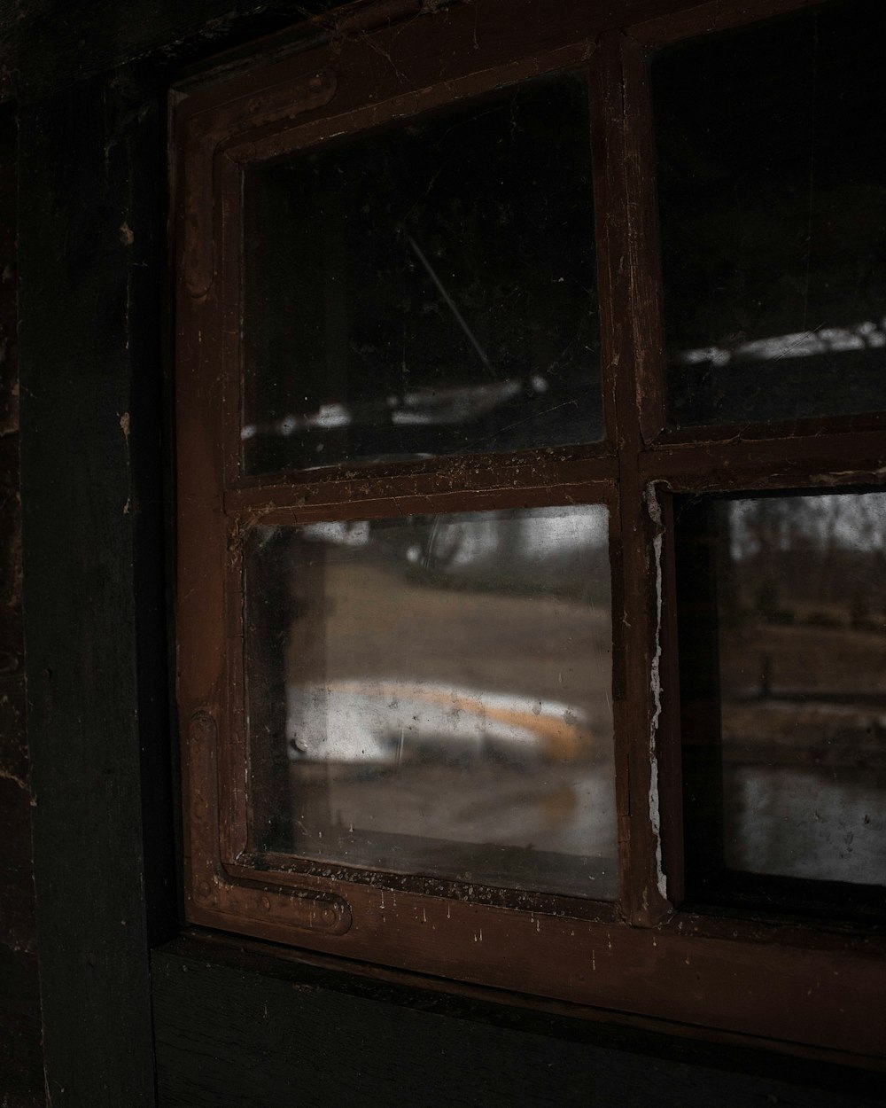 brown wooden framed glass window