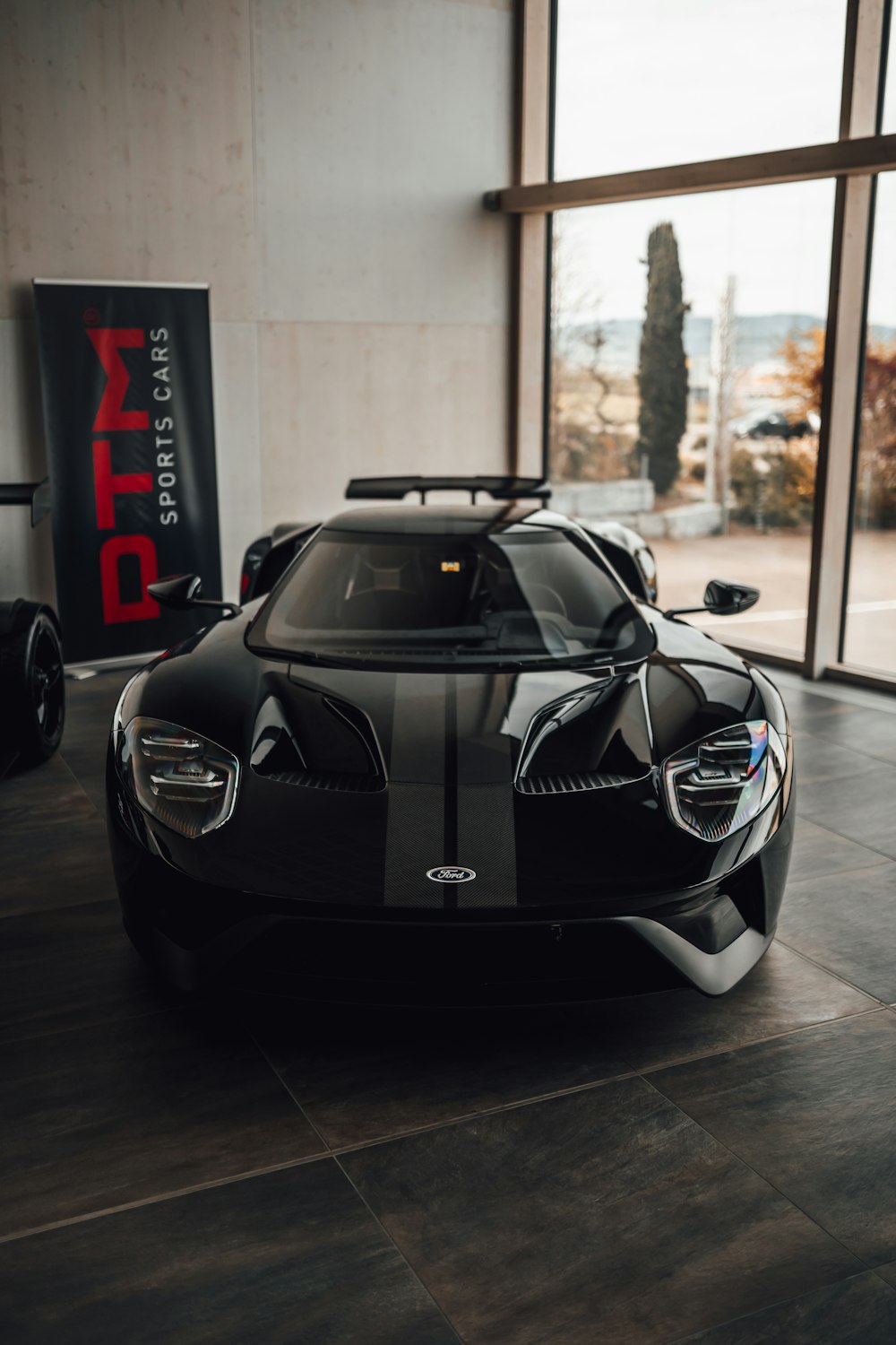 black lamborghini aventador in a room