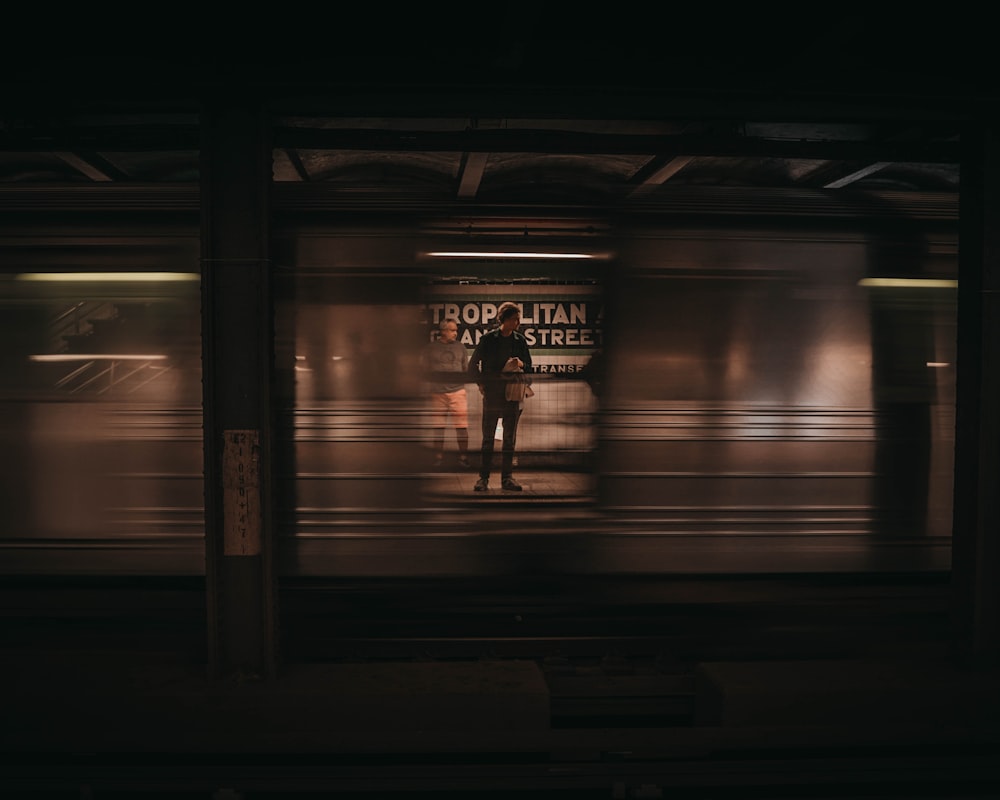 person standing in train station