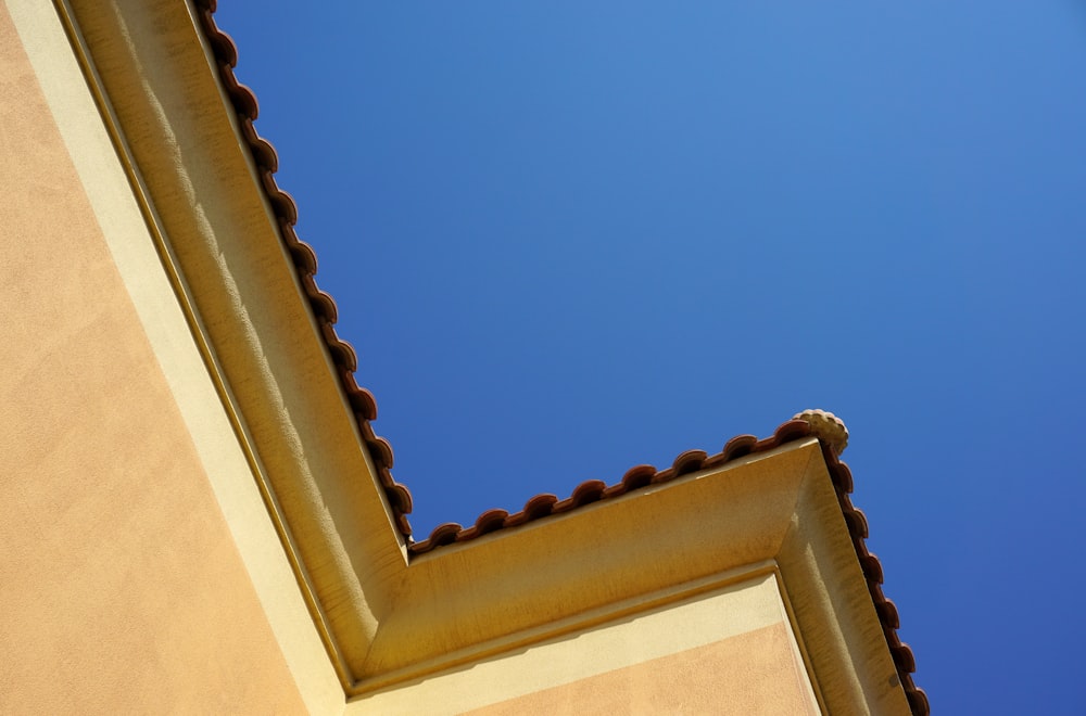 brown concrete building under blue sky during daytime