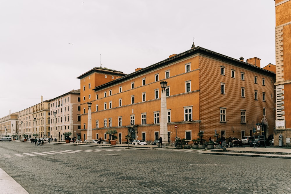 people walking on street near brown concrete building during daytime