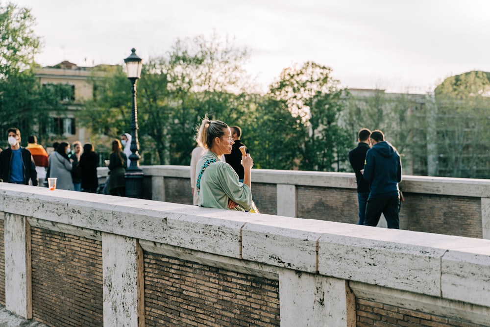 woman in white shirt standing beside man in black jacket