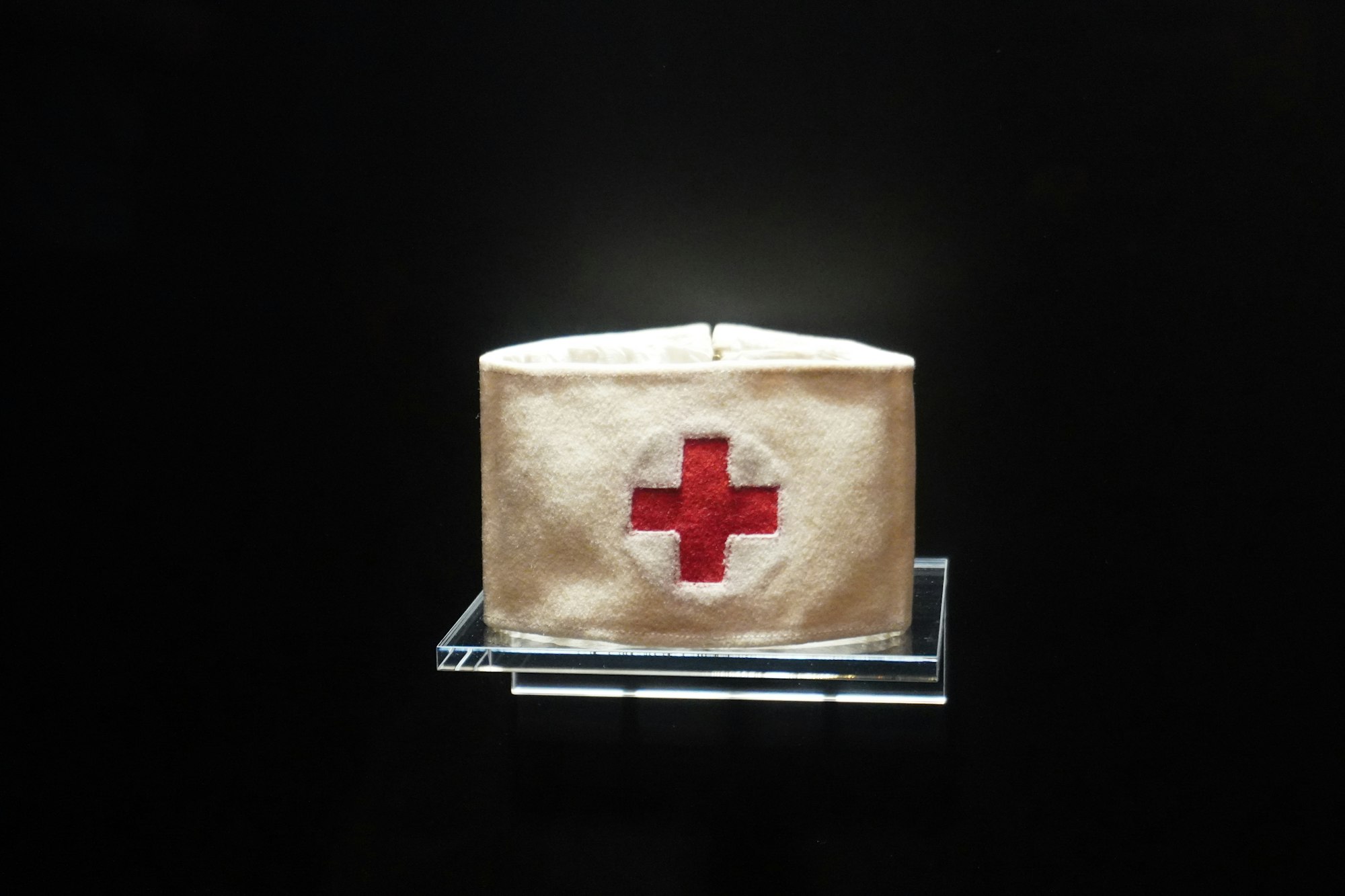 A picture of an old red cross armband. 