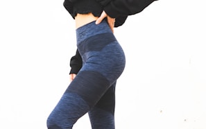 person in black long sleeve shirt and blue denim jeans