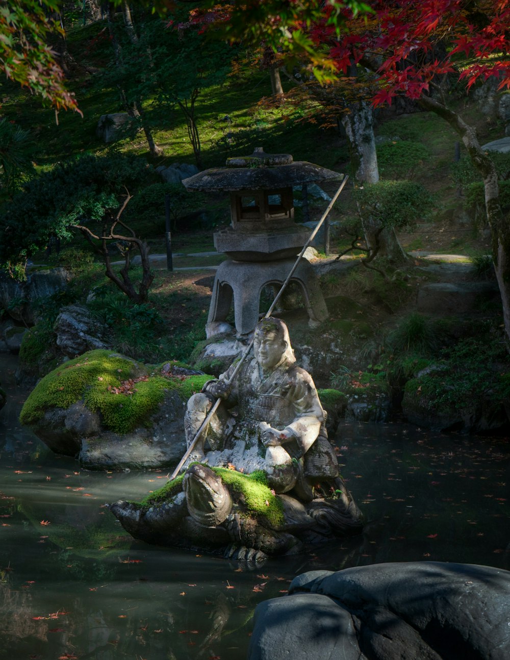 gray stone on river during daytime