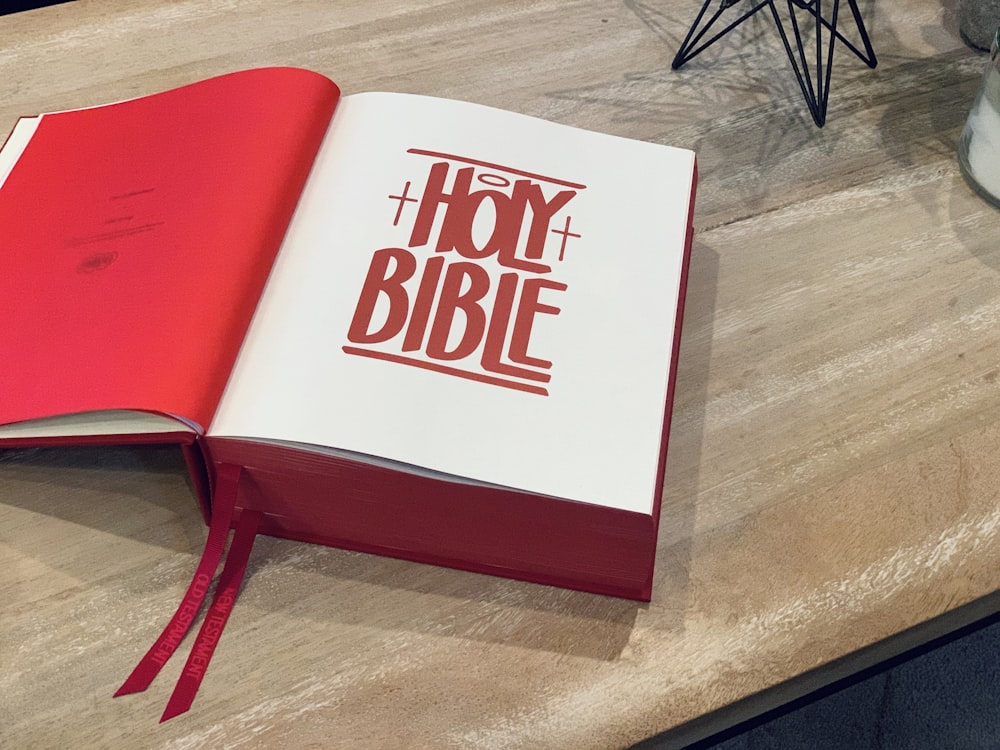 red and white book on brown wooden table