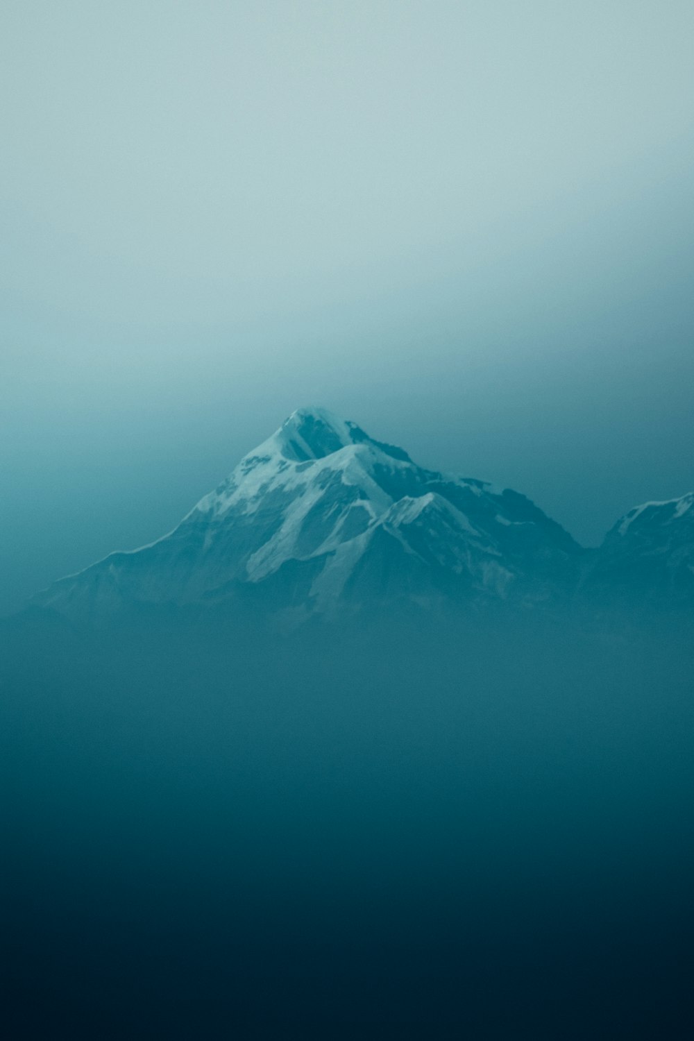 snow covered mountain during daytime