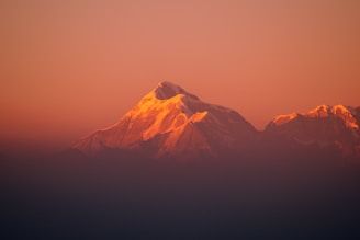 silhouette of mountain during sunset