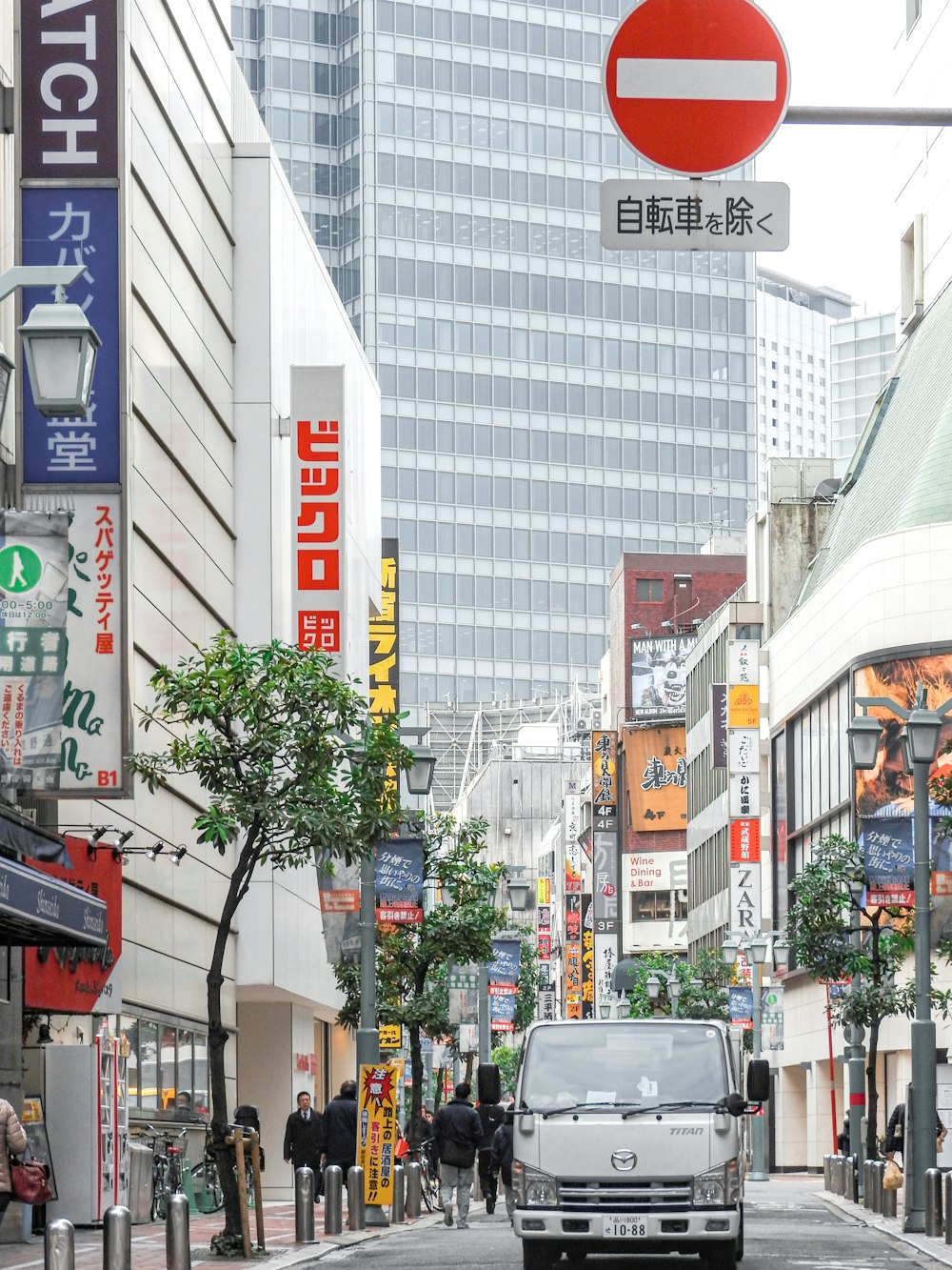 cars on road near buildings during daytime