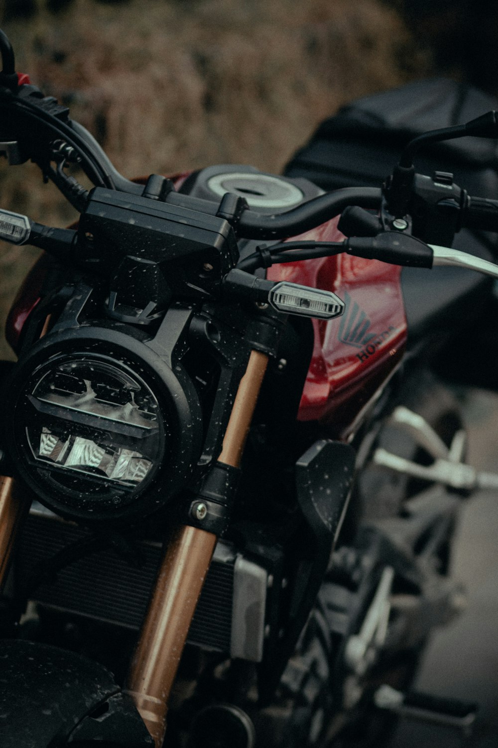 black and red motorcycle in close up photography