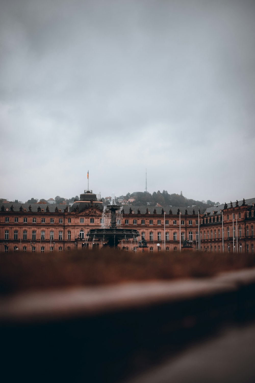 brown concrete building under gray sky