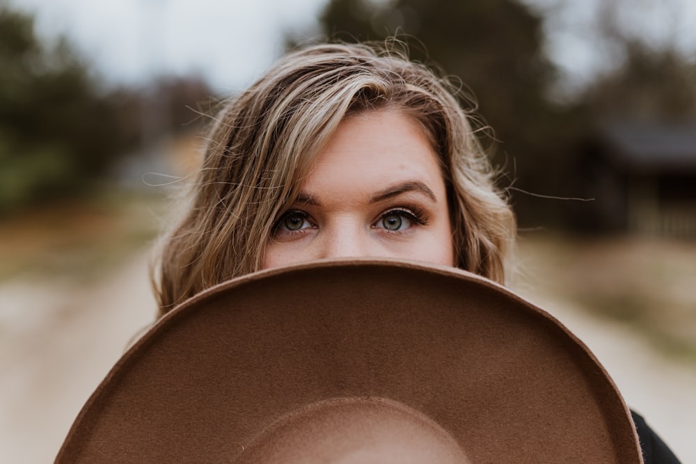 woman in brown hat during daytime