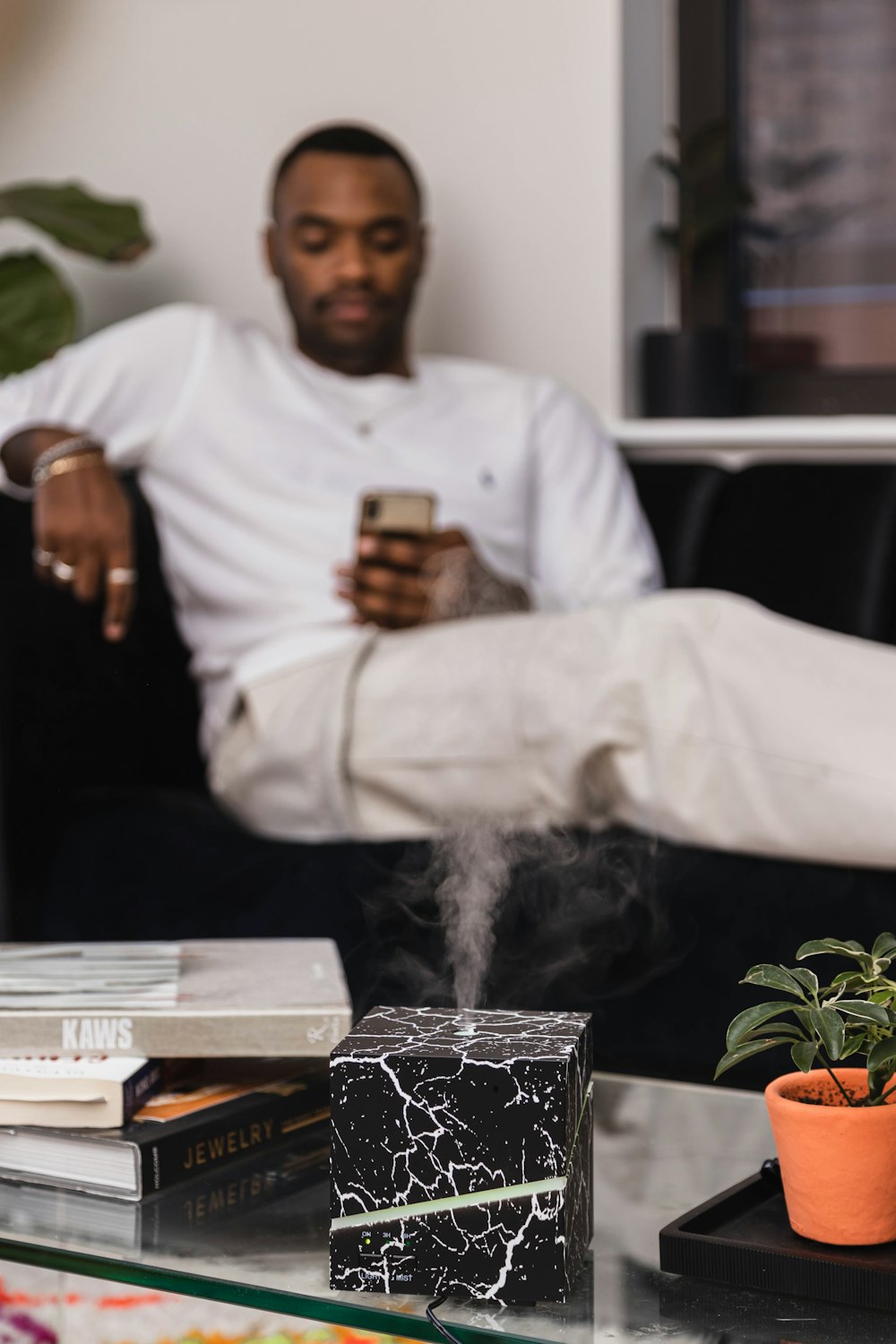 man in white long sleeve shirt sitting on chair