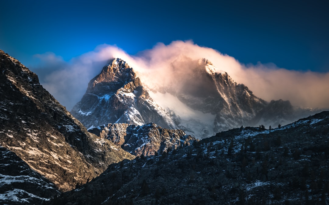 snow covered mountain under blue sky during daytime