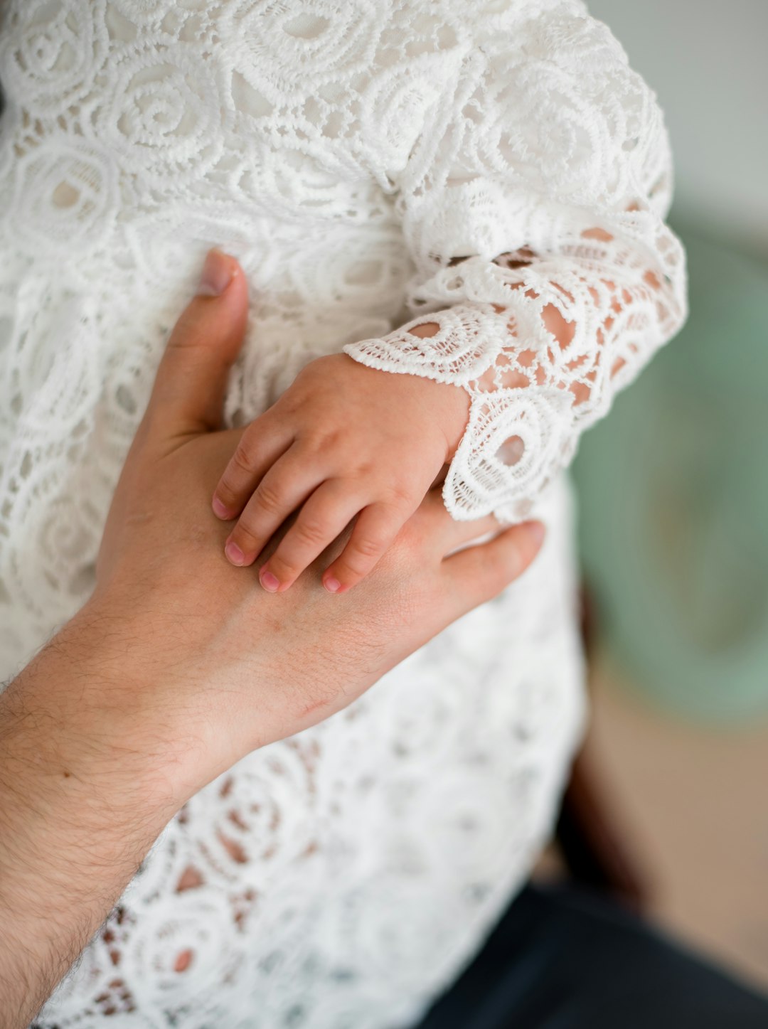 person in white lace long sleeve shirt