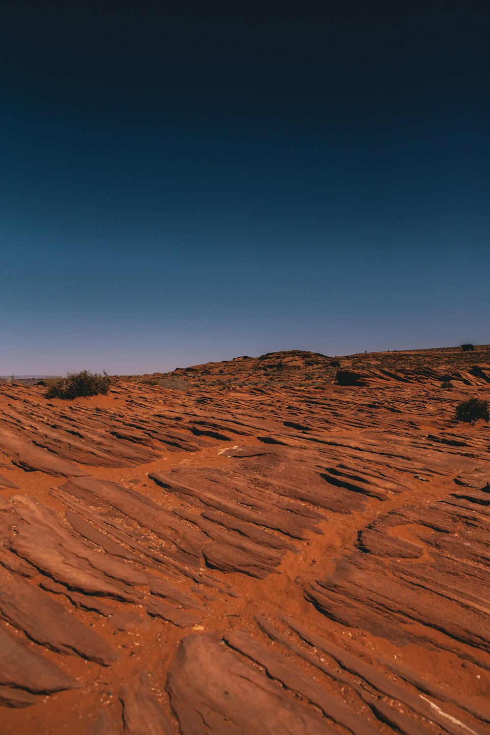 brown sand under blue sky during daytime