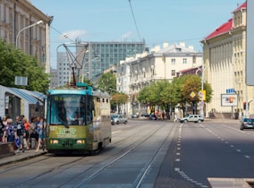yellow and white tram on road during daytime