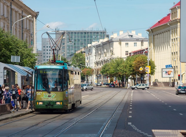 yellow and white tram on road during daytime