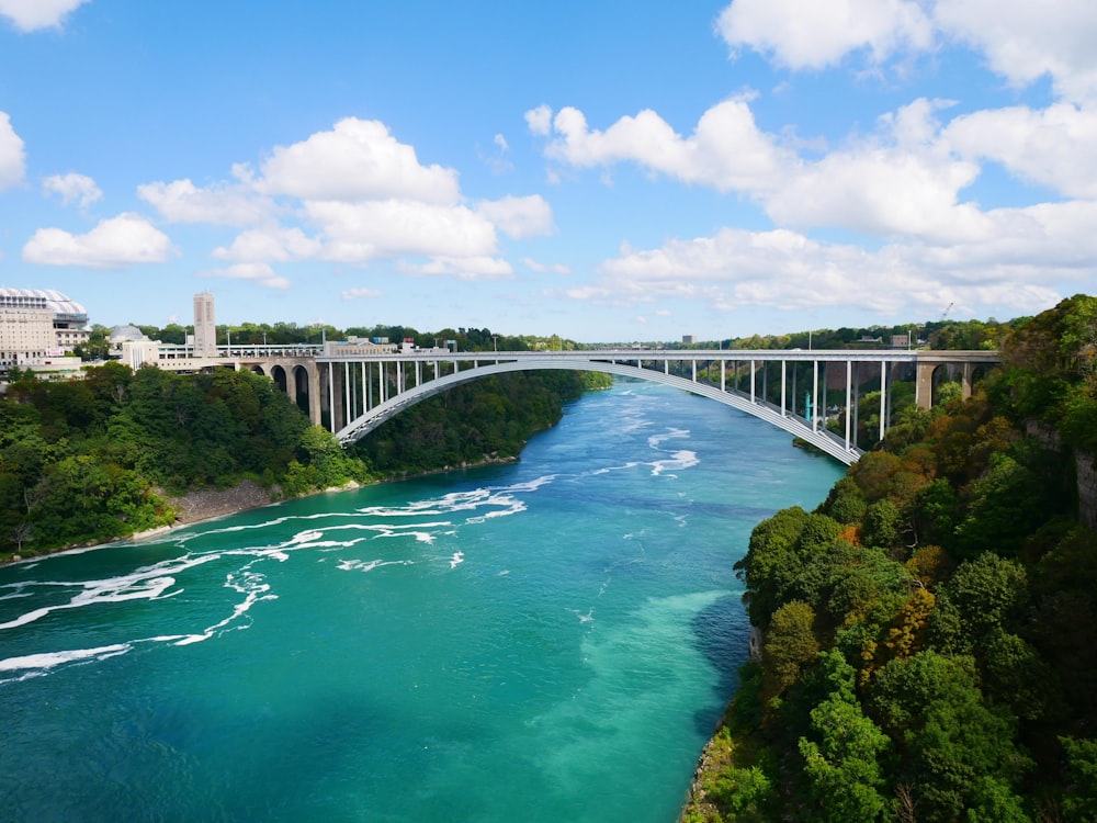 white bridge over river during daytime