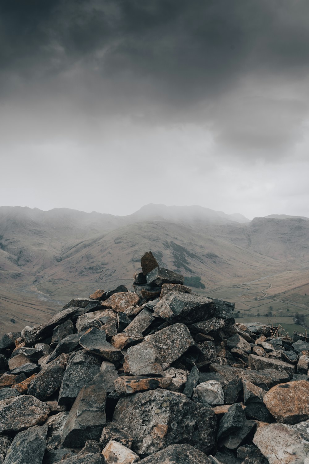 brown rocky mountain under white sky during daytime