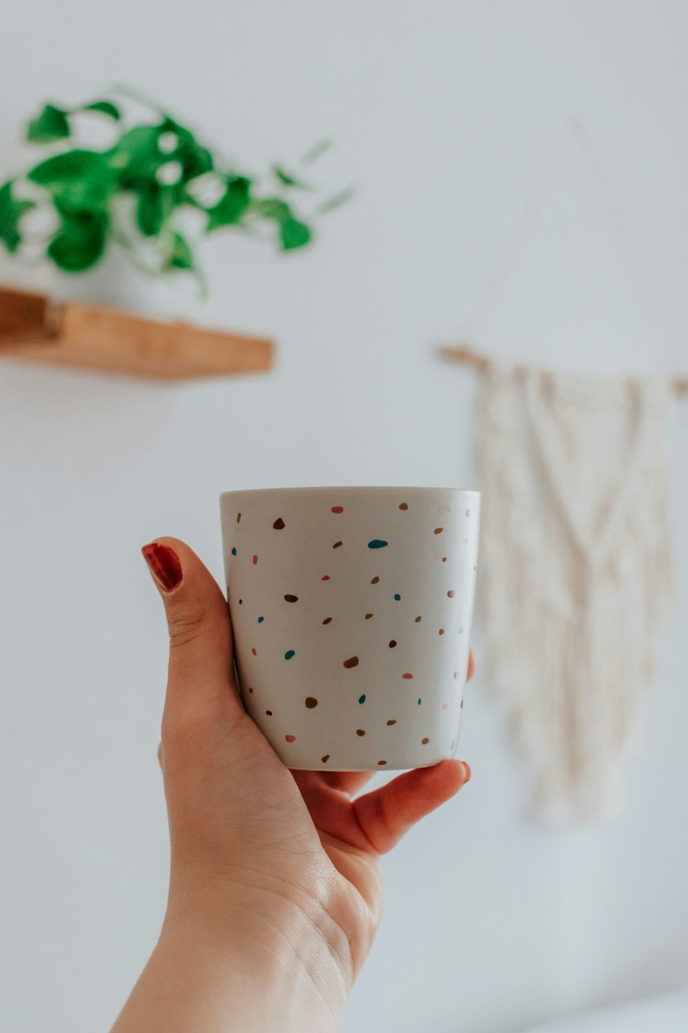 white and black polka dot ceramic mug