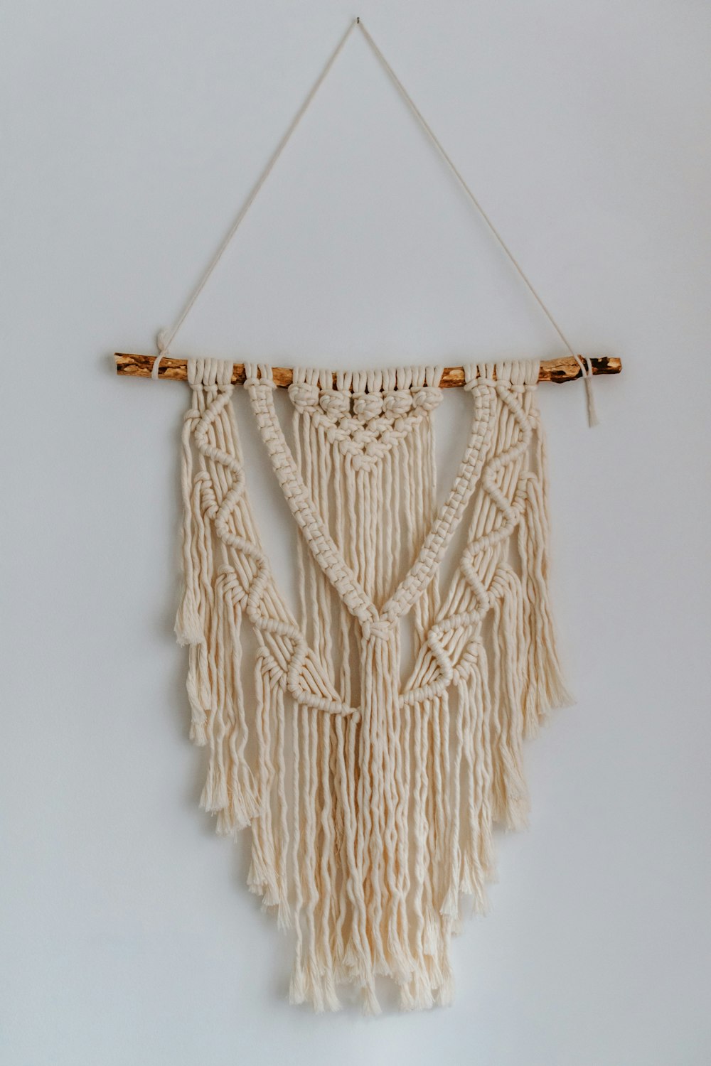 brown rope on white wall