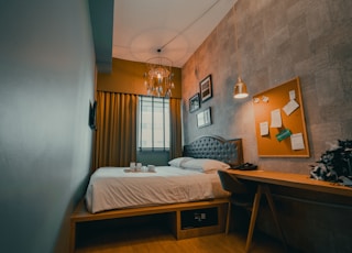 white bed linen on bed