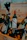 Happy man unpacking a variety of drinks from a Vinovia delivery box in his kitchen