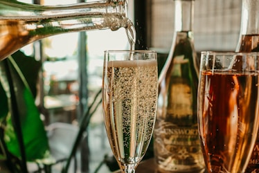 clear wine glass with brown liquid