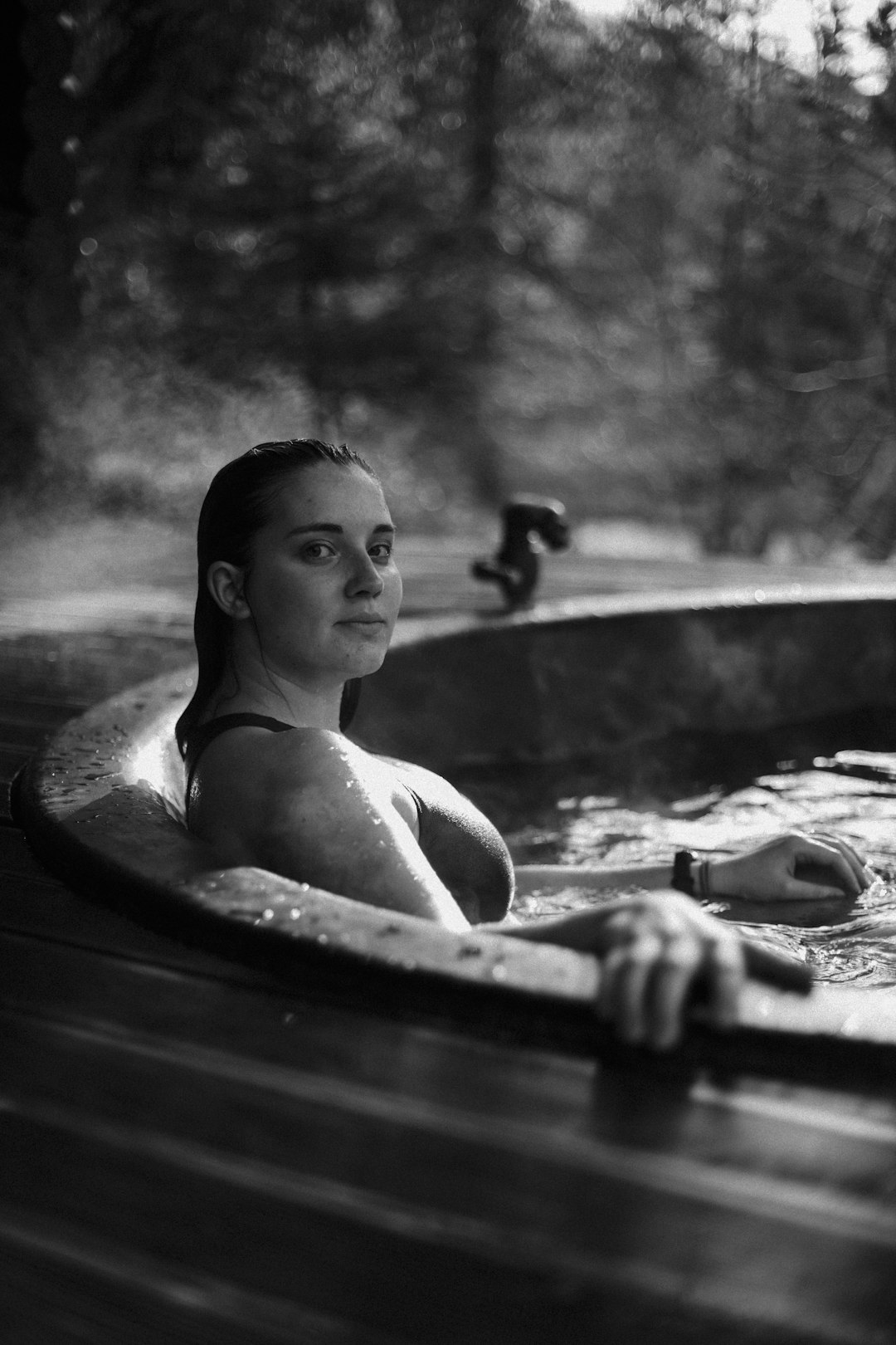 grayscale photo of girl in bathtub