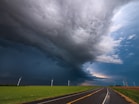 gray asphalt road under gray clouds