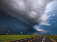 gray asphalt road under gray clouds