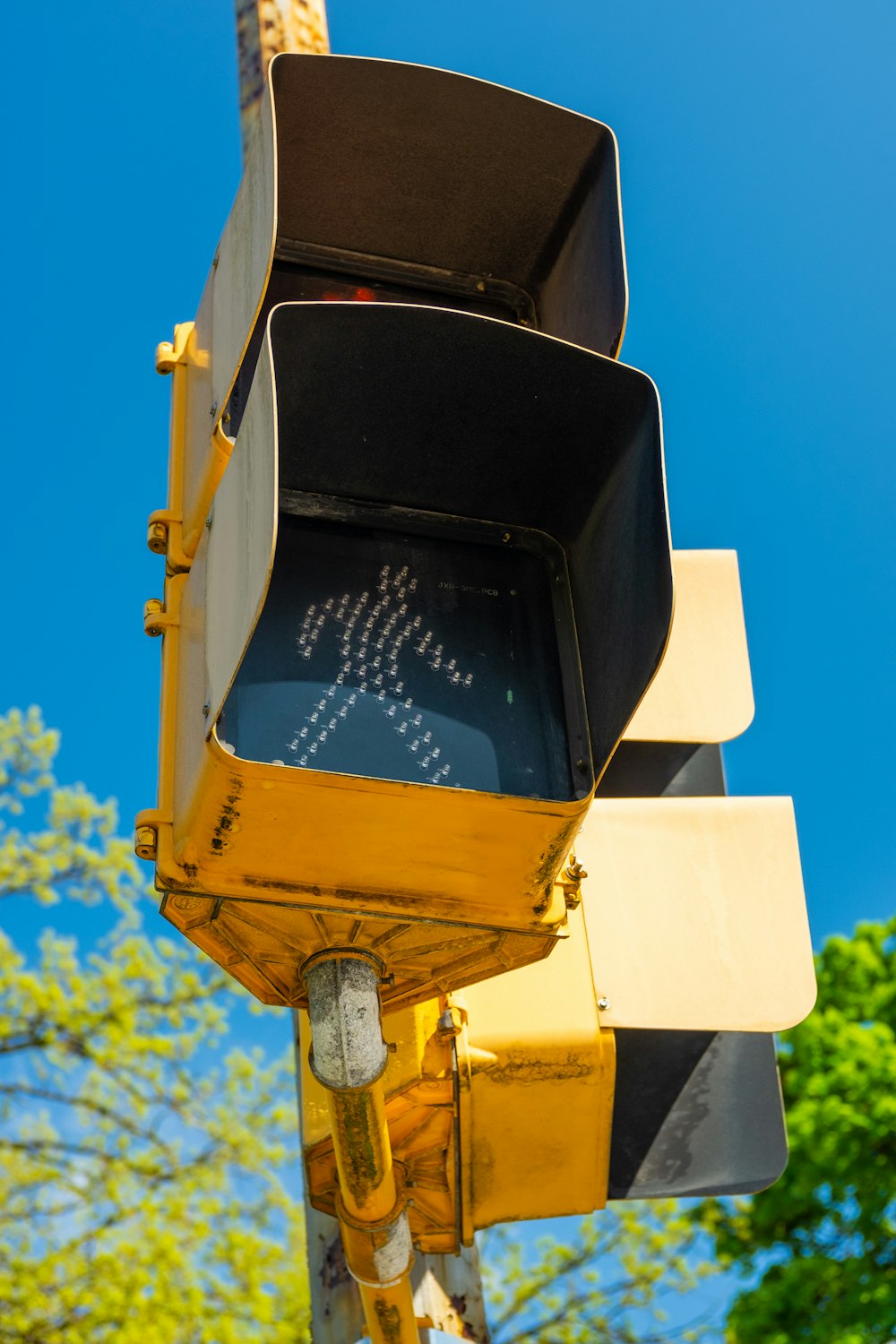 yellow traffic light turned on during daytime
