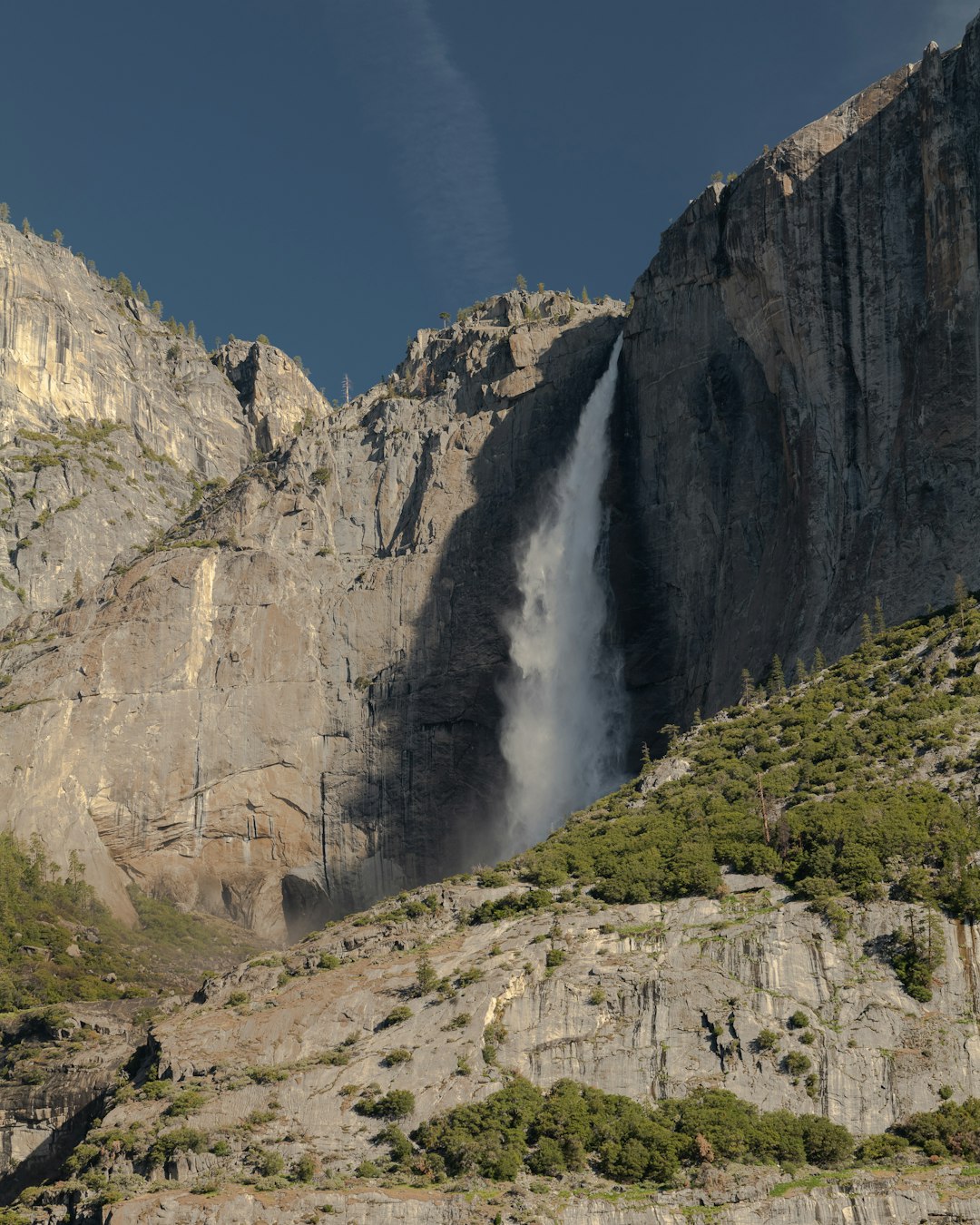 waterfalls on rocky mountain during daytime