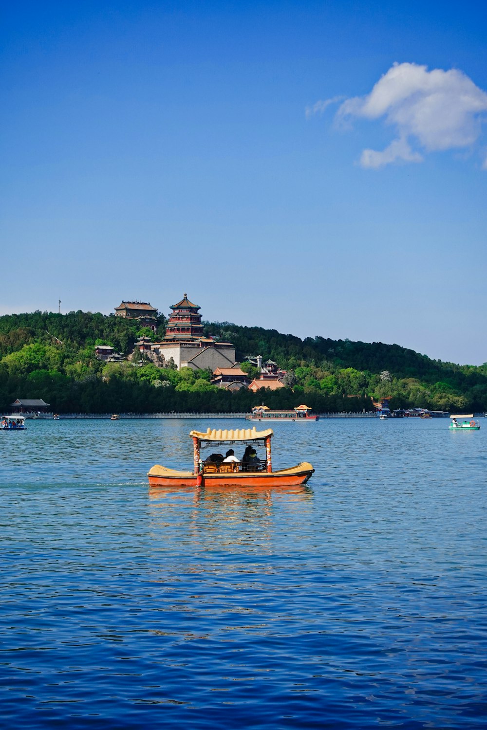 people riding on boat on body of water during daytime