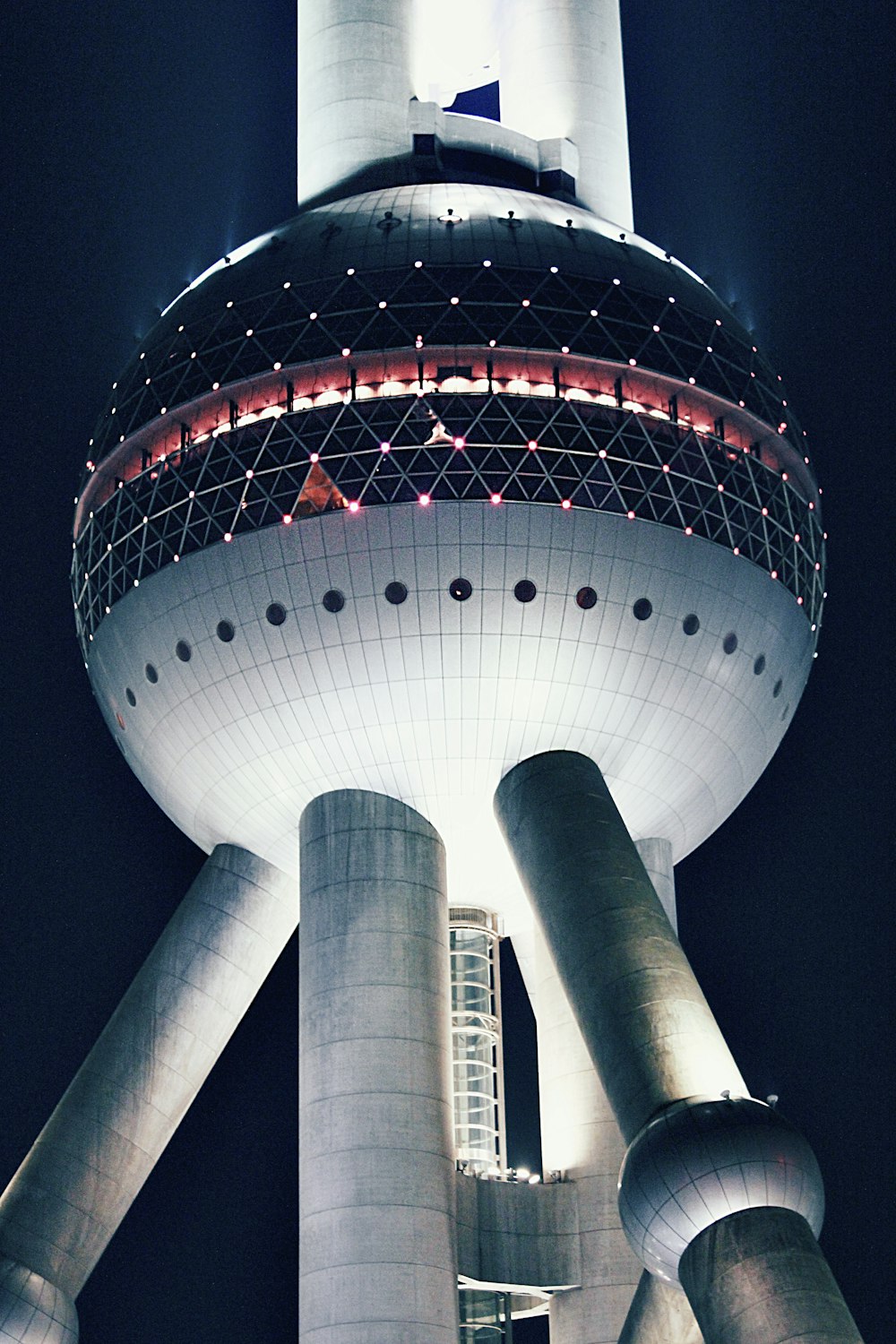 white and red round building